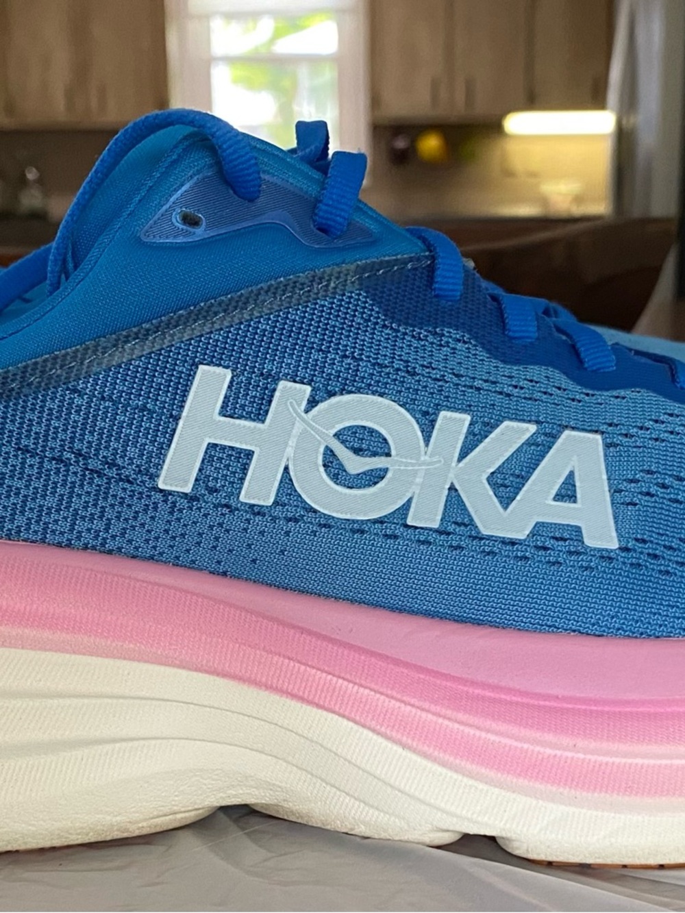 Hoka Bright Blue Running Shoe with Pink Insole Accent